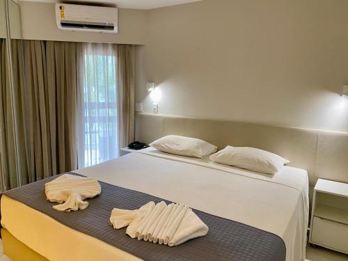 Postel nebo postele na pokoji v ubytování Jatiuca Suítes Resort FLAT