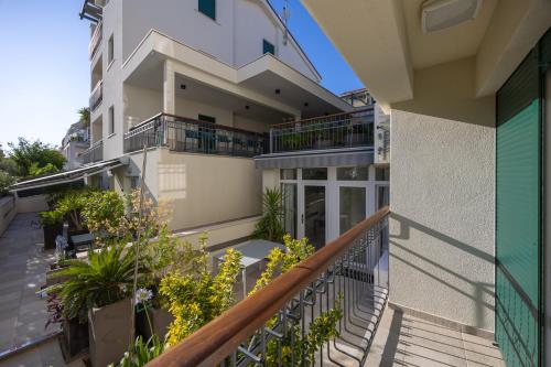 a balcony of a building with plants at Hotel - Teranea City Hvar in Hvar
