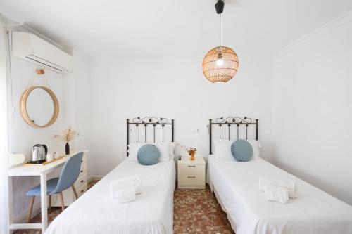Ένα ή περισσότερα κρεβάτια σε δωμάτιο στο Hostal San Miguel by Croma