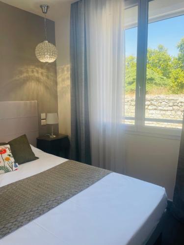 Postel nebo postele na pokoji v ubytování Brit Hotel Acacias