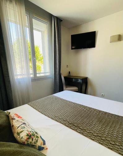Postel nebo postele na pokoji v ubytování Brit Hotel Acacias