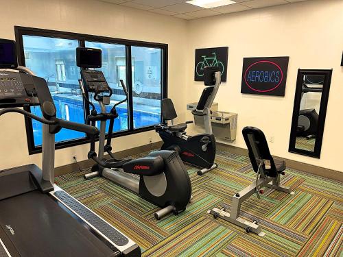 a gym with treadmills and ellipticals in a room at Holiday Inn Express & Suites Shippensburg by IHG in Shippensburg