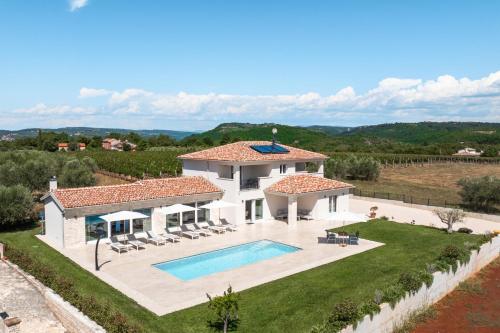 an aerial view of a villa with a swimming pool at Villa Juki by Briskva in Kaštel
