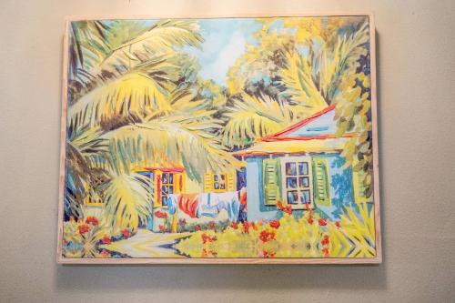 a painting of a house with palm trees at New Port Richey Downtown Delight! in New Port Richey