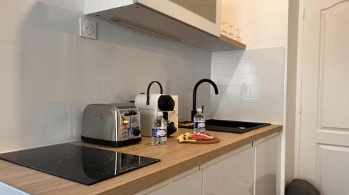 Køkken eller tekøkken på Le Privilège Cosy Central Chic