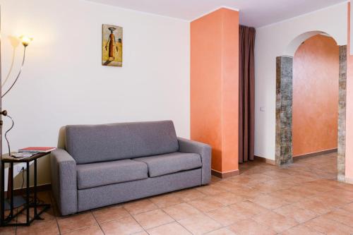 a living room with a couch and a table at Dormi'Re in Caserta