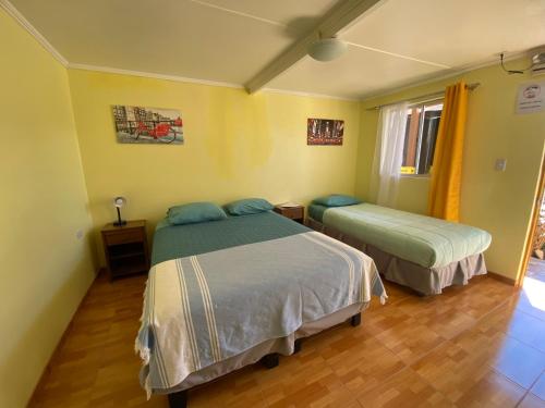 Ένα ή περισσότερα κρεβάτια σε δωμάτιο στο Hostal Travel House