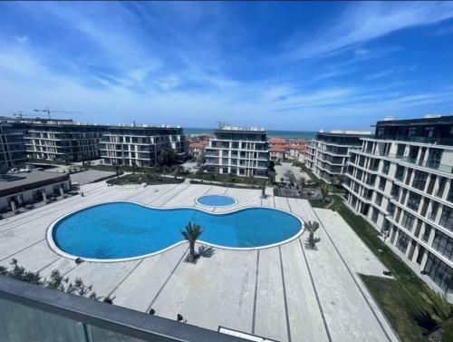 a large swimming pool on the roof of a building at Avshan Polo 10 in Baku