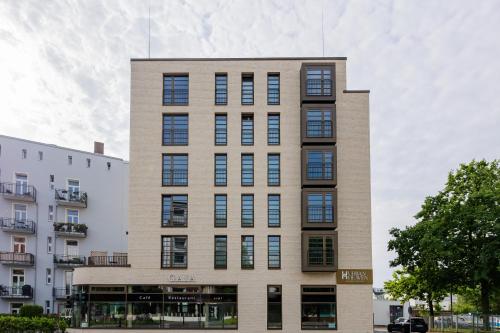 a tall brick building with windows on the side of it at Urban Heaven Aparthotel in Hamburg