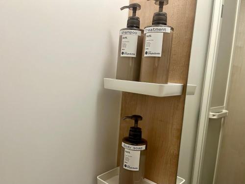 a group of three oxygen bottles sitting on a wall at とすアジュール in Tosu