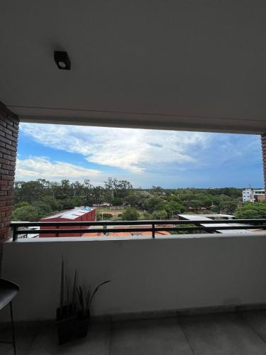 a window in a room with a view of a building at Departamento entero en San Lorenzo in San Lorenzo