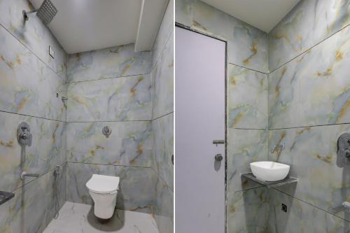a bathroom with a toilet and a shower at Hotel O Dream Space in Ahmedabad