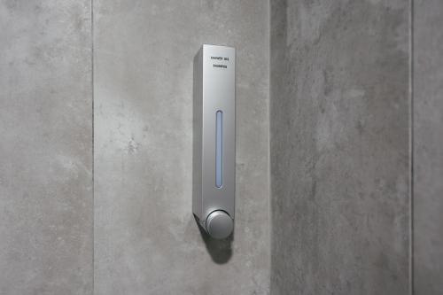 a remote control sitting on top of a wall at Cameron Centrum Breeze Cozy Retreat Clover Home A-2-15B in Brinchang