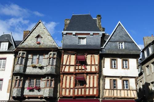 an old building with windows and balconies on a street at Ti ma zud 2 in Plestin-les-Grèves