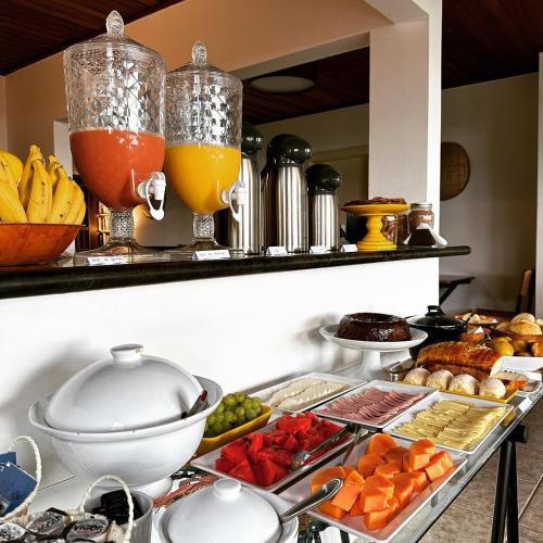 a buffet with fruits and vegetables on a table at Pousada Sambaki in Paraty