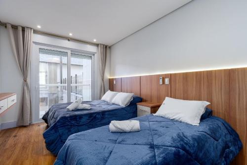 Postel nebo postele na pokoji v ubytování Residencial Vêneto 1 dorm Achei Gramado