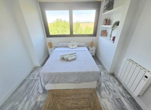 Katil atau katil-katil dalam bilik di Coqueto Apartamento con Terraza y Piscina
