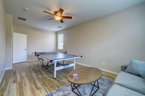 a living room with a ping pong table and a couch at Desert Bliss Heated Pool Power Ranch Perks in Queen Creek