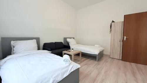 En eller flere senge i et værelse på Business-Apartments Neumünster Zentrum