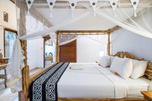 Ένα ή περισσότερα κρεβάτια σε δωμάτιο στο salaoni villa ubud