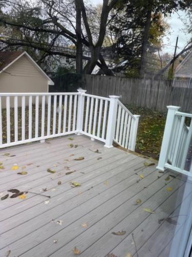 a deck with a white fence and some leaves at N Lake Ontario 3BR Home Near Beach Seabreeze in Rochester