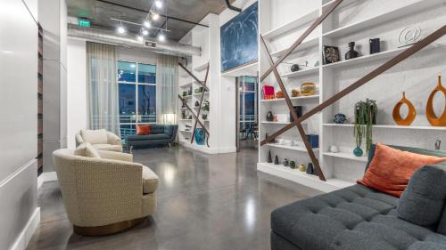 a living room with two chairs and a couch at Tropicana Field 1 Bed in Downtown With Free Parking in St Petersburg