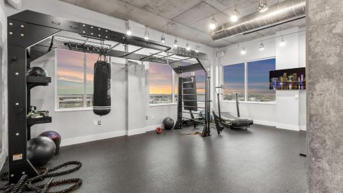 a gym with a punching bag on the wall at Tropicana Field 1 Bed in Downtown With Free Parking in St Petersburg