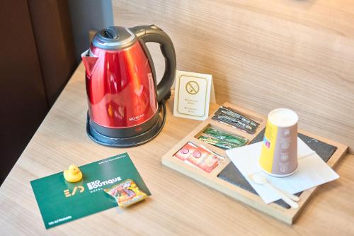 a table with a tea kettle on a table at eXo Boutique Hotel Mannheim - by SuperFly Hotels in Mannheim