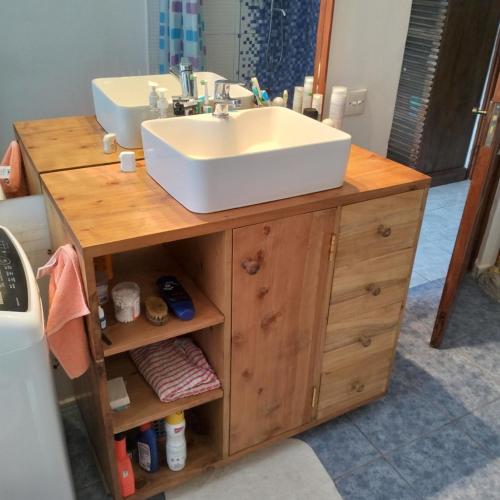a bathroom with a sink on a wooden vanity at Fiocco di neve in Watamu