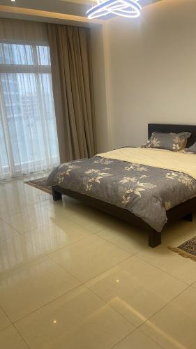 a bed sitting in a room with at Bahrain Amwaj in Amwaj Island