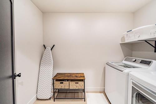 a laundry room with a washer and dryer at Stylish Townhome Walkable Garage in Driggs