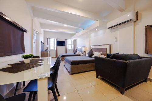 a living room with a couch and a table at Ulala Culebra in Culebra