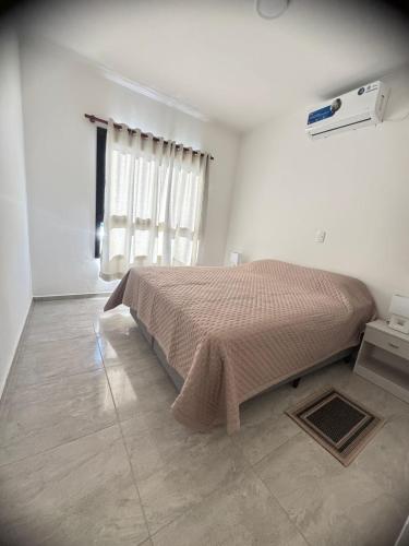 Ένα ή περισσότερα κρεβάτια σε δωμάτιο στο Alojamiento Termas de Federacion a 200 metros