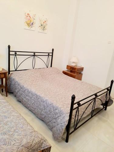 Postel nebo postele na pokoji v ubytování Iris' Home