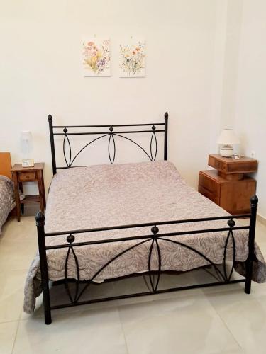 Postel nebo postele na pokoji v ubytování Iris' Home