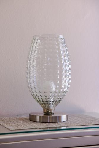 a clear glass vase sitting on top of a table at Ulala Culebra in Culebra