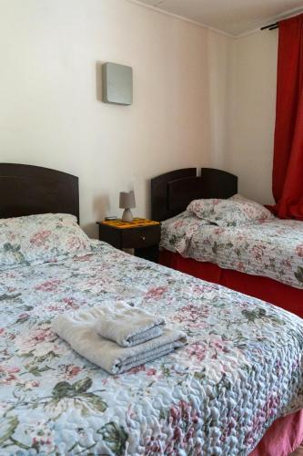 Ένα ή περισσότερα κρεβάτια σε δωμάτιο στο Hostal Eden