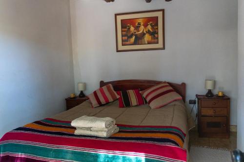 Ένα ή περισσότερα κρεβάτια σε δωμάτιο στο Hostal Eden