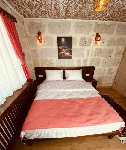 Postel nebo postele na pokoji v ubytování Cherrykonak cappadocia
