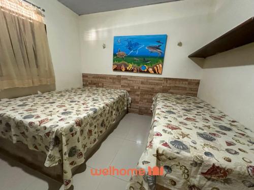 Katil atau katil-katil dalam bilik di Casa em Natal com piscina 4min da praia