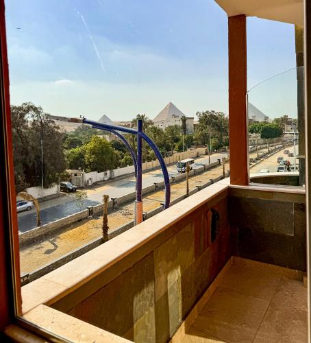 a window with a view of a street at Almas Pyramids Hotel in Cairo