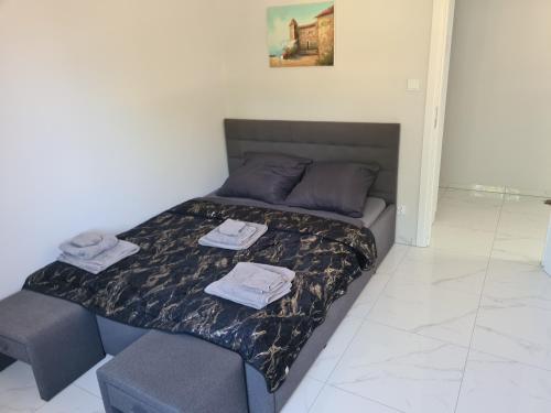 Una cama o camas en una habitación de DS Apartament