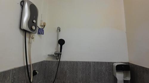 a bathroom with a shower in a wall at Le Meridien BnB in Negombo