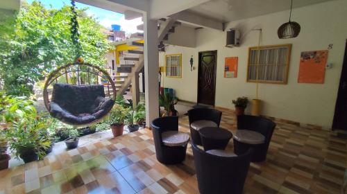 a room with a bunch of chairs and a table at Pousada Solar Encanto do Marajó in Soure