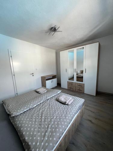 a bedroom with a bed and a ceiling at Melissa luxury Apartment in Bijelo Brdo