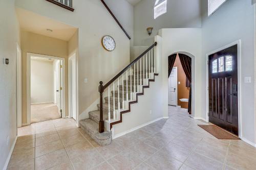 a staircase in a home with a stair case at Private Theater and Pool Spacious Mission Home in Mission