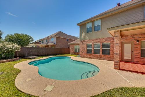 a swimming pool in the yard of a house at Private Theater and Pool Spacious Mission Home in Mission