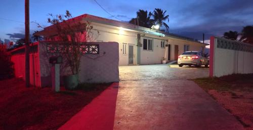 a car parked in front of a house with a parking meter at Ventana Va104 at Arecibo 681 Ocean Drive in Arecibo