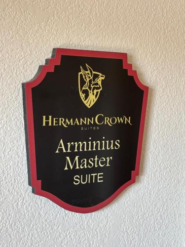 a sign for an anticulture master suite on a wall at Hermann Crown Suites in Hermann