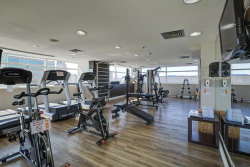a gym with several treadmills and exercise bikes at Park Inn by Radisson Berrini in Sao Paulo